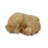 A CHINESE YELLOW JADE 'CAT' GROUP.
