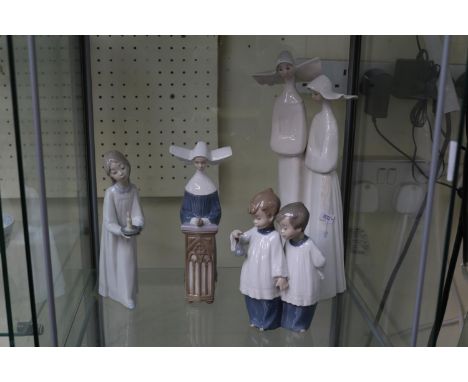 Collection of Nao and Lladro figures of Nuns, Choir Boys and a girl with candlestick (4) 