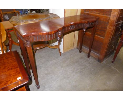 An Adams style inlaid mahogany serpentine console table 