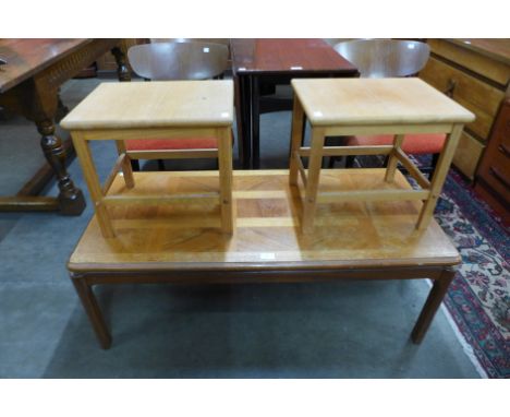 A Nathan teak coffee table and a pair of beech coffee tables 