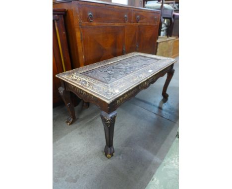 An Indian carved softwood coffee table 