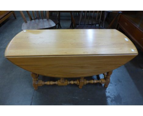 An Ercol Blonde ash drop leaf coffee table 