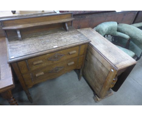 A carved oak chest of drawers and an oak gateleg table 