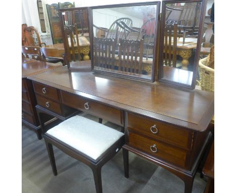 A Stag Minstrel mahogany dressing table and stool 