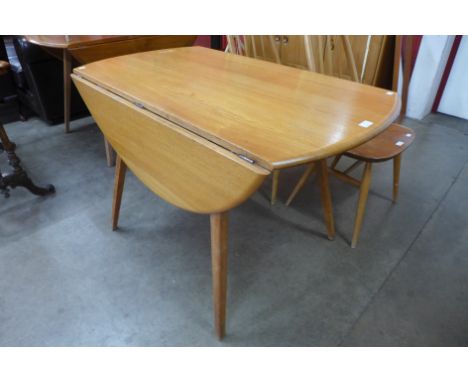 An Ercol Blonde elm and beech Windsor drop leaf table 