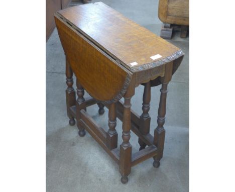 A small carved oak gateleg table 