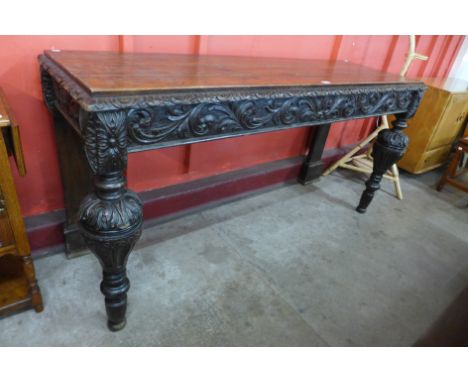 A Victorian Elizabethan Revival carved oak serving table 