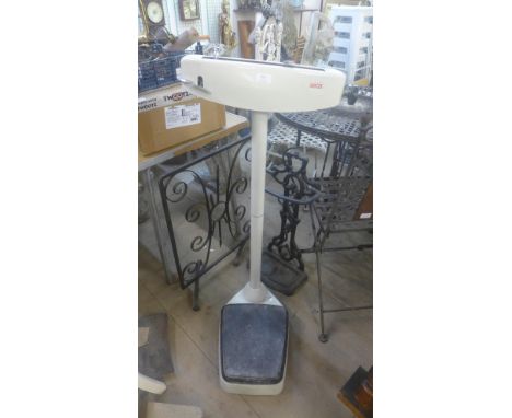 A cast iron stick stand, a wrought iron fire screen and a set of scales 