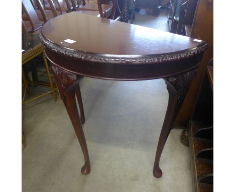 A mahogany demi-lune hall table 