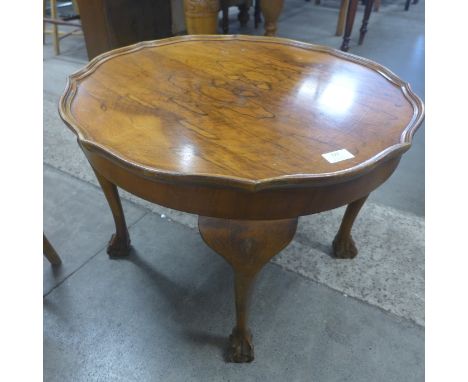 A teak coffee table, a walnut coffee table and a mahogany stool 