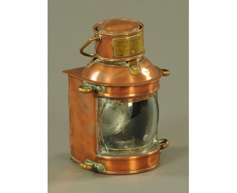 A ships lantern, with brass carrying handle and applied brass plate inscribed "Overtaking Patt. 4895 Metal Industries Ltd., H