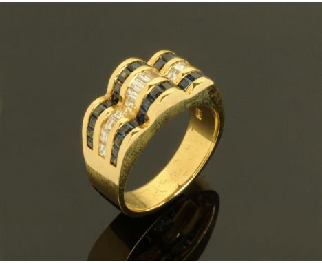 A Continental 18 ct gold channel set sapphire and diamond ring, with square and baguette cut stones, size M. 