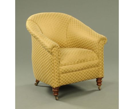 A Victorian tub chair, with sprung seat and gold lozenge upholstered material, all upon turned tapering mahogany legs termina