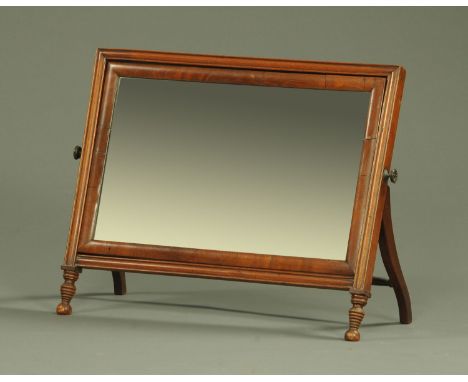 A 19th century mahogany framed dressing table mirror, with easel back and raised on short turned front legs.  Width 57 cm. 