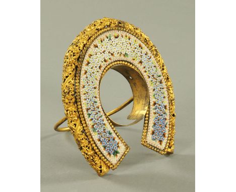 A micro mosaic pocket watch stand, of horseshoe shape with easel back, early 20th century.  Height 14.5 cm, aperture diameter