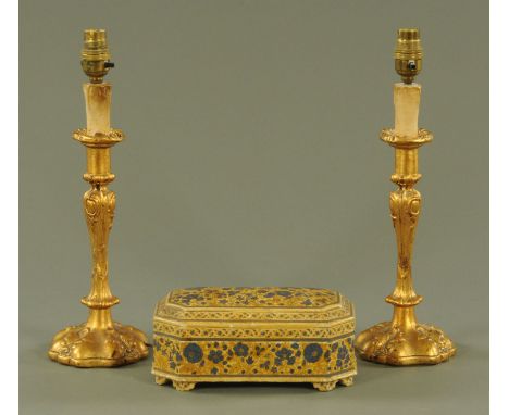 An early 20th century Kashmiri papier mache box, marked to base "Ganemede Srinagar, Kashmir ...", length 22 cm and two gilded