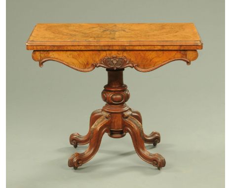 A Victorian walnut turnover top card table, with green baize playing surface and applied moulding to the frieze, with turned 