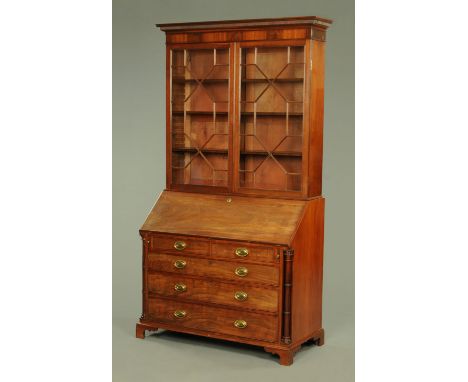 A good Georgian mahogany bureau bookcase, with reeded and moulded pediment above astragal glazed doors enclosing adjustable s