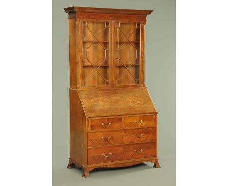 A 19th century  mahogany bureau bookcase, with moulded dentil cornice above a pair of glazed door with wooden astragals openi