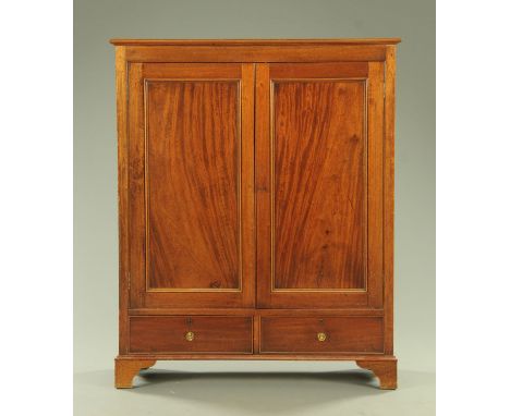 A mahogany cupboard, late 19th century, the top with moulded edge above two panelled doors enclosing two fixed shelves, above