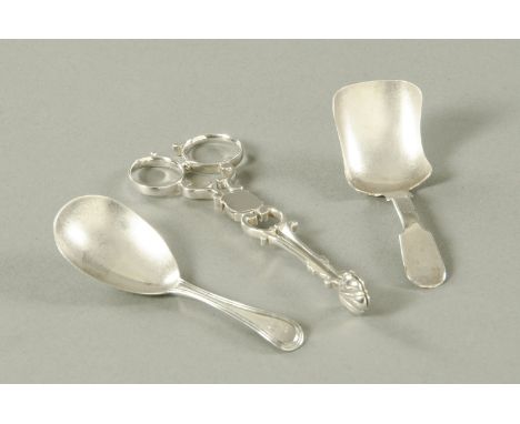 A pair of silver sugar nips, makers initials IG, two silver caddy spoons, Peter and William Bateman, London 1807 and George U