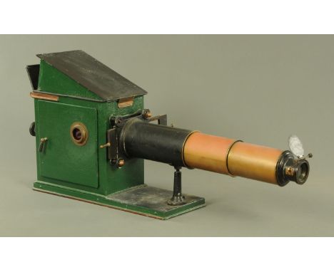 A 19th century magic lantern projector, with 59 cm lens tube, adjustable levers to the reverse.  45 cm high.