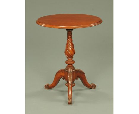 A Victorian mahogany tripod table, with twist column and three downswept foliate carved legs terminating in scroll feet.  Dia