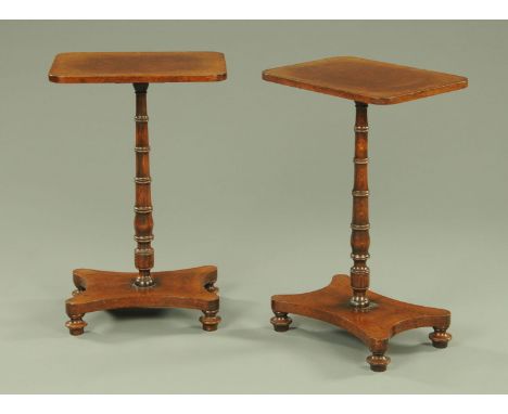 A pair of Regency style quarter veneered rectangular lamp tables, with turned columns and quatreform bases raised on bun feet