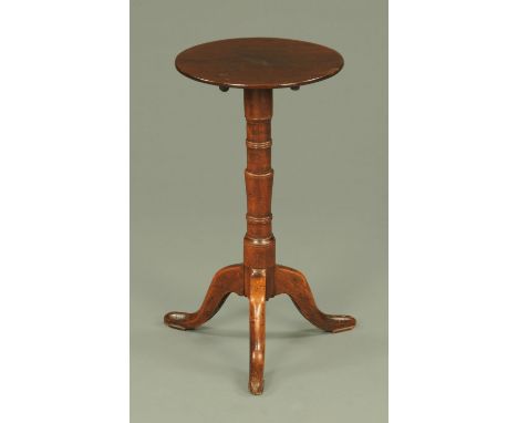 A Georgian mahogany tripod table, with circular top on a ring turned column with three downswept legs.  Diameter 36.5 cm, hei