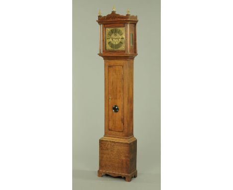 An 18th century oak longcase clock, the square brass dial with Roman numerals and with subsidiary seconds dial and with ring 