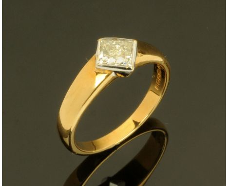 An 18 ct two tone gold princess cut diamond ring, diamond weight +/- .70 carats.