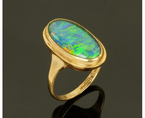 A ladies 9 ct gold dress ring set with opal, size M.  CONDITION REPORT: 4.1 grams.  Visible stone dimensions 19 mm x 9 mm.  D