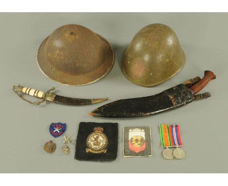 Two Asian World War Two period steel helmets, British Victory and Defence Medals, Royal Air Force embroidered patch, printed 