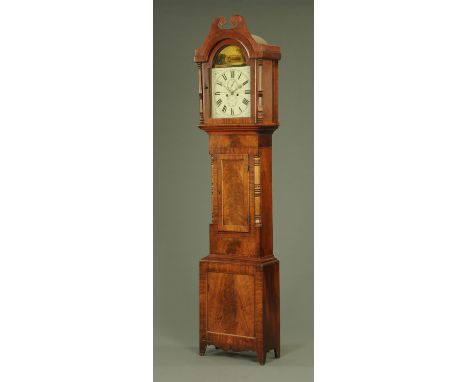 An early 19th century mahogany longcase clock, the arched painted dial with Roman numerals and subsidiary seconds date dials,