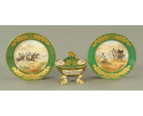 A pair of French porcelain plates, late 19th century, each decorated with Napoleon at Wagram or Ingolstadt, each framed by a 