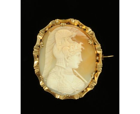 A finely carved shell cameo brooch, 19th century, carved as a female warrior with Grecian style headdress and breast plate wi