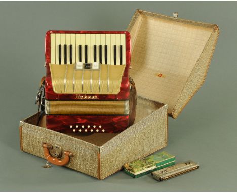 A vintage Hohner accordion, with three treble and twelve bass buttons, in original case, and a Hohner Echo Harp mouth organ a
