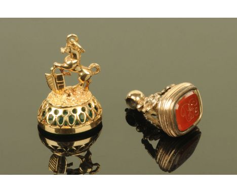 A late Victorian 9 ct gold Intaglio seal, carved with a Grecian warrior's head, the seal surmounted by a rearing horse with s