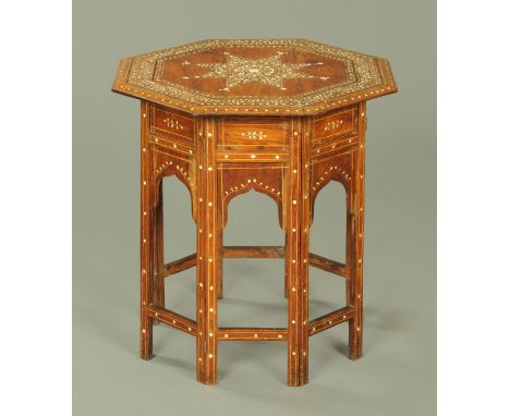 A Damascus hardwood and bone inlaid octagonal table, 19th century, with star motif to the centre with foliate fronds and with