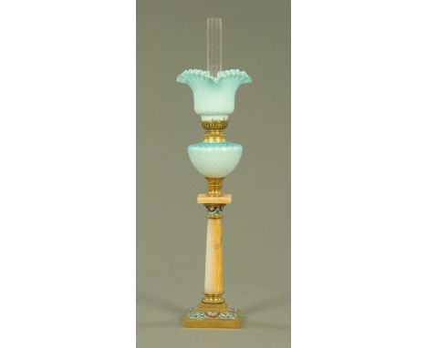 A French satin glass oil lamp, late 19th century, with satin glass and honeycomb moulded shade and reservoir on an alabaster 