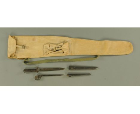 A German World War II bayonet, the ricasso with unusual markings, with wood grip, metal scabbard, the blade 25 cm, together w
