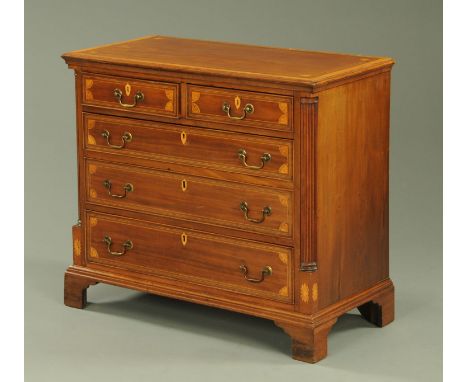 A 19th century mahogany chest of drawers, satinwood crossbanded and fitted with two short and three long graduated drawers wi