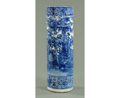 A Japanese stencilled blue and white stick stand, early 20th century, decorated with nine scholars within a bamboo grove, 62 