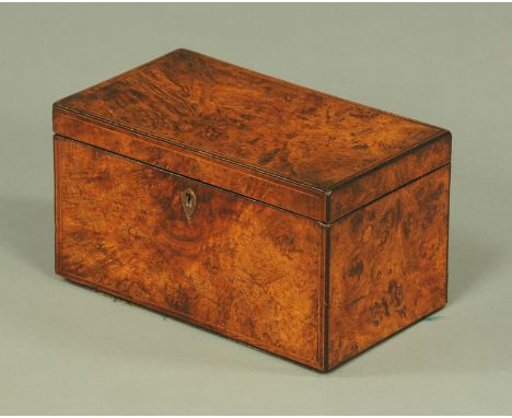 A Regency burrwood tea caddy, the well figured top with boxwood stringing opening to two plush lined compartments with mahoga