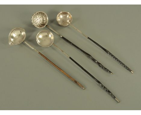 A George III silver punch ladle, makers mark erased, London 1816 and three further Georgian white metal punch ladles, unmarke