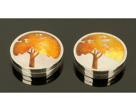 A pair of silver and enamel pillboxes, of circular form, the lids enamelled with oak trees, makers initials "NG", Edinburgh 1