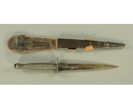 A Fairbairn Sykes world War Two Commando fighting knife, Mark III, with painted alloy ribbed handle, the pommel cast with No.