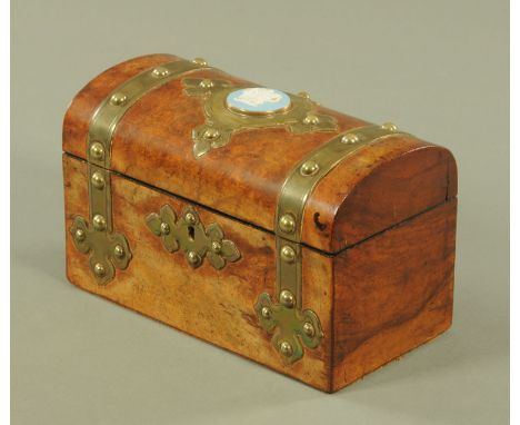 A Victorian walnut brass bound tea caddy, with blue Jasperware plaque to lid, two interior compartments.  Width 23 cm. 