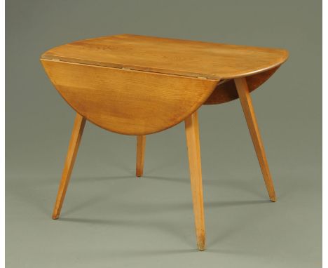 An Ercol light elm drop leaf dining table, circa 1960/70's, supported on four tapering square legs.  Width 118 cm (leaves ope