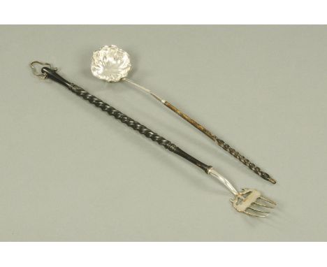 A silver toasting fork, Nathan and Hayes, Chester 1898, with turned ivory handle and white metal suspension loop, together wi